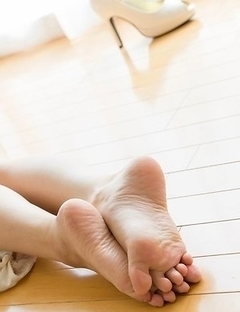 Mio Yoshida lifts up her legs to show off those divine feet on the floor