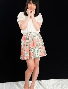 Cheerful teen Reo Saionji posing seductively in her stockings and stylish heels