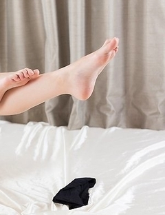 Pantyhose-clad babe Rio Kamimoto fingers herself and poses showing her bush