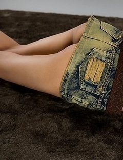 Karina Oshima posing in her sexy skirt before going down on the floor to masturbate