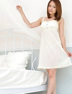 Rina Itoh smiles and shows sexy legs under cute dress