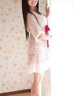 Mayumi Yamanaka smiles while undressing with erotic moves