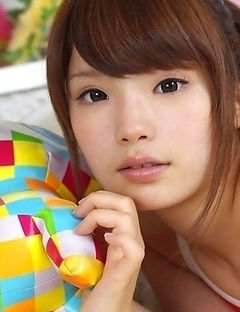 Manami Sato with sexy curves in bath suit plays with pillow