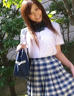 Schoolgirl Iyo Hanak poses at the open air in sexy skirt