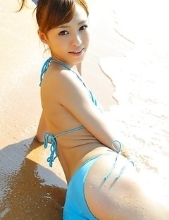 Aino Kishi in blue bath suit is a true beauty enjoying sand