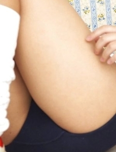 Brunette Ageha Yagyu smiles posing on camera with her pretty body