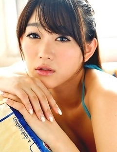 Shou Nishino in blue bath suit sits with ass up in the air